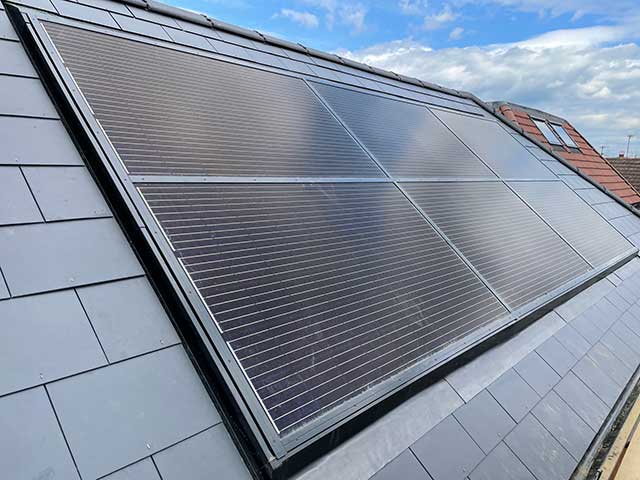 Solar panels on roof with grey slates