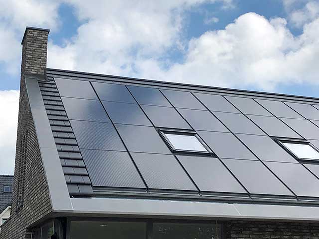 solar panels on roof with grey slate chimney