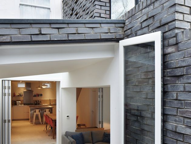 brick lean-to extension crafted from grey brick in a textured format
