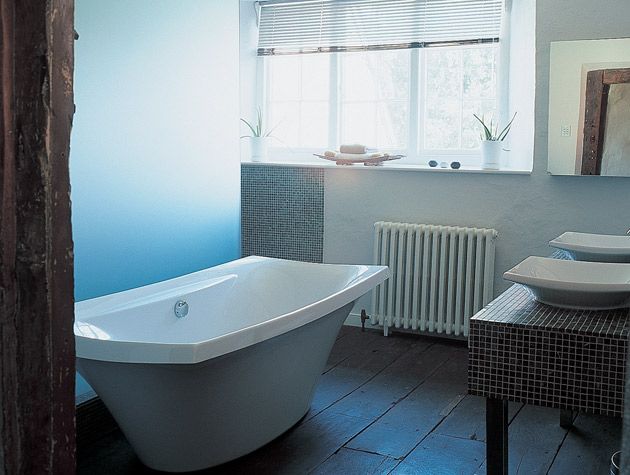 16th century farmhouse with contemporary bathroom and freestanding bath