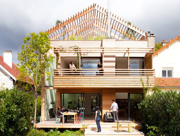 low carbon house near Paris with open pitched loft structure as a pergola and rooftop garden