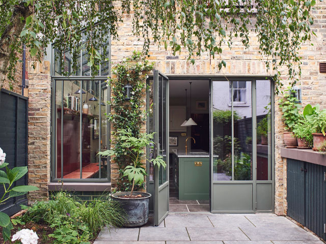 Terrace house extension with fixed glazing and casement doors