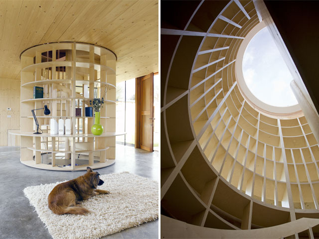 sculptural wooden staircase with in-built desks and skylight