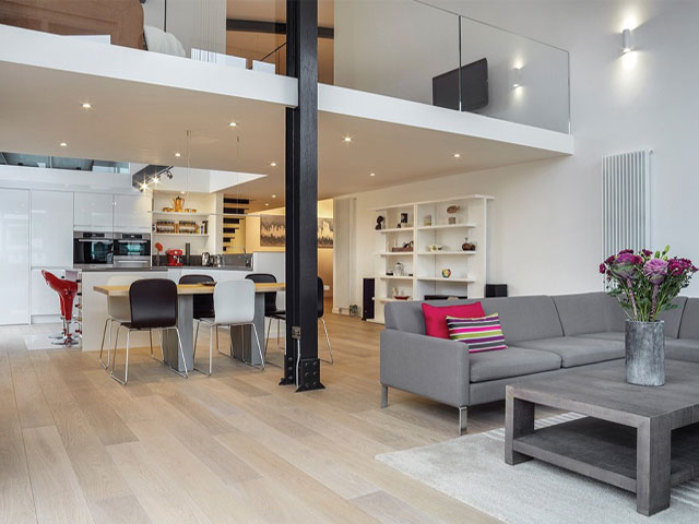 engineered oak wood flooring in double-height open-plan space with underfloor heating