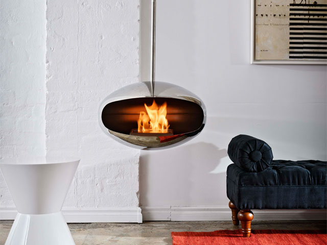 Modern fireplace design:  Cocoon Aeris is ethanol burning, available in stainless steel or carbon black and rotates 360°