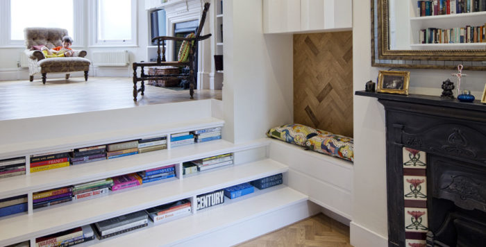 a reading nook in the stairs - use the steps themselves for storage