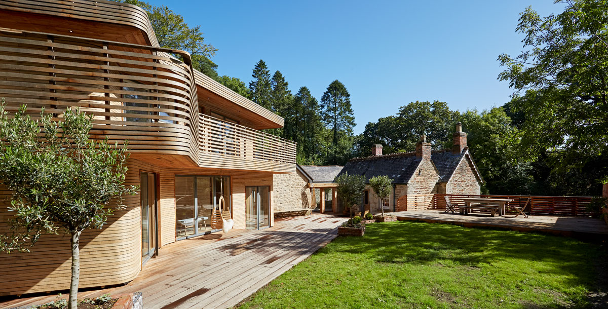Outside the steam-bent timber house from Grand Designs