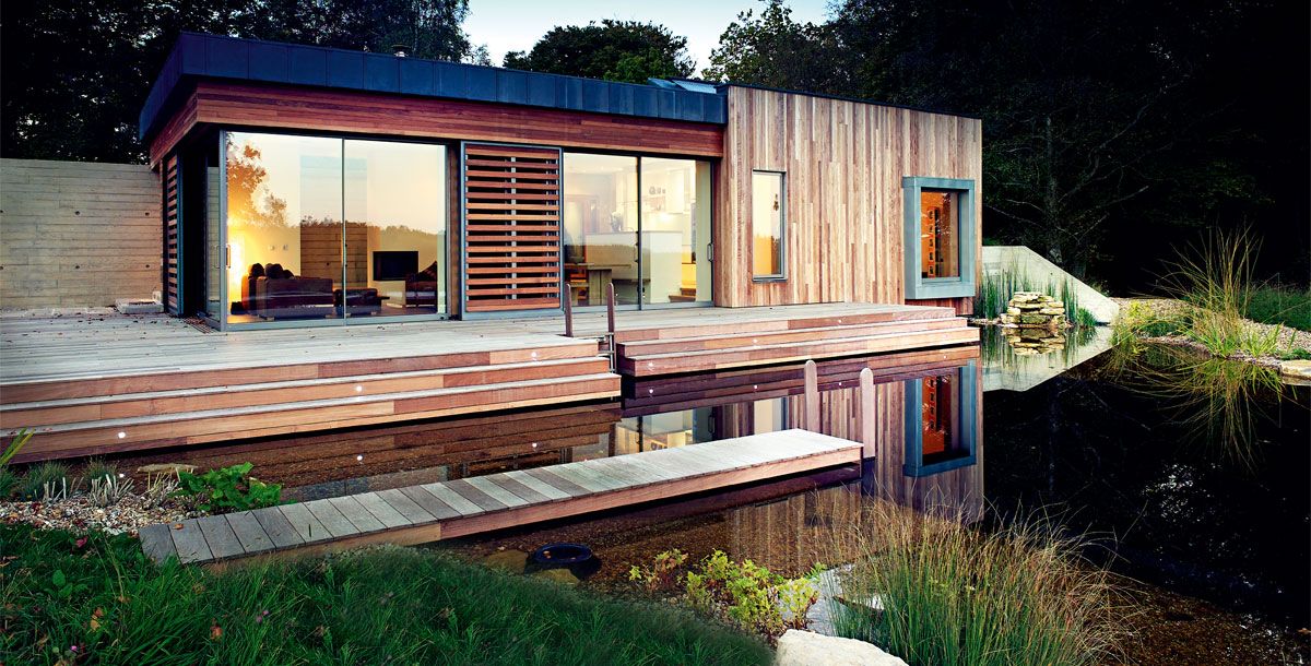 Stoney Cross timber eco house by a pond