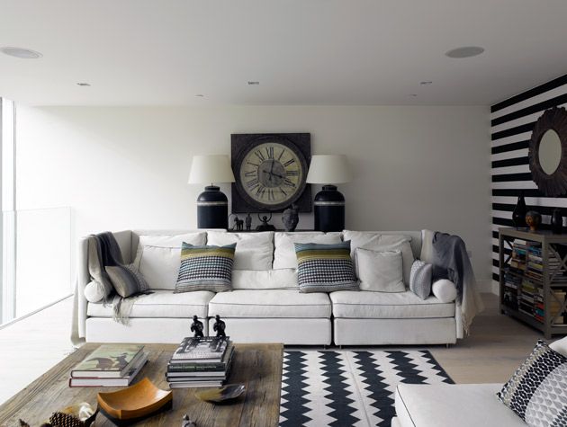 Inside the Grand Designs water tower in Kennington, with monochrome living room decor