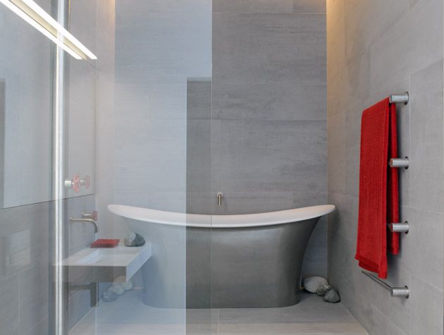 Modern grey bathroom with roll-top bath and walk-in shower