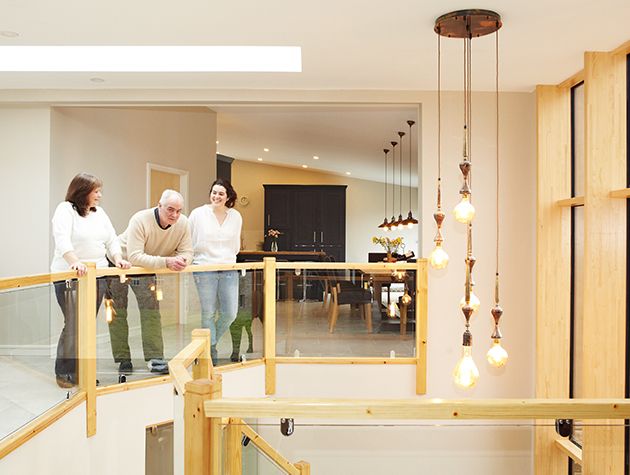 huge atrium hallway with sweeping staircase from the grand designs bolton house