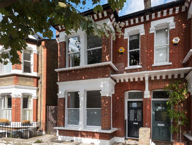 Victorian semi renovation exterior red brick large bay windows 