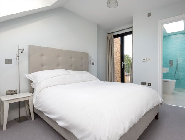Victorian semi renovation ground floor bedroom double doors beige headboard aquamarine walled en suite bathroom
