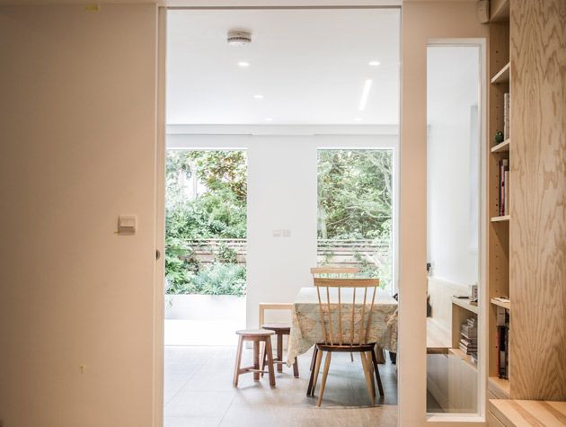 simplify your space. Beige hallway walls dining room with wooden stools doorway leading to garden