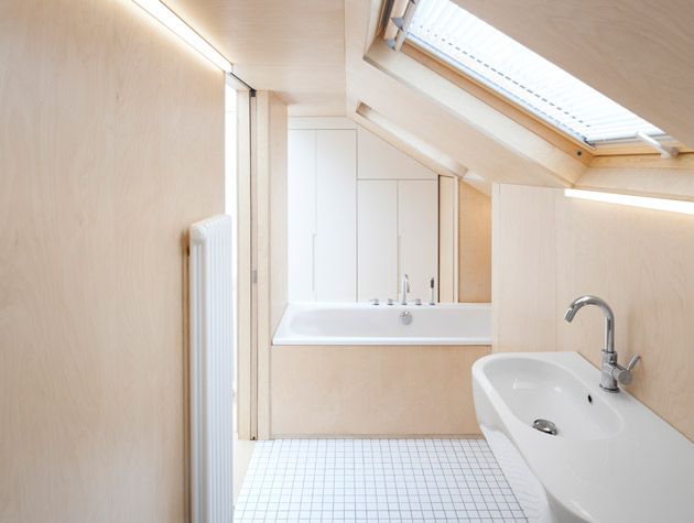 beige loft bathroom recessed led lighting small white tiled floor velux rooflight 