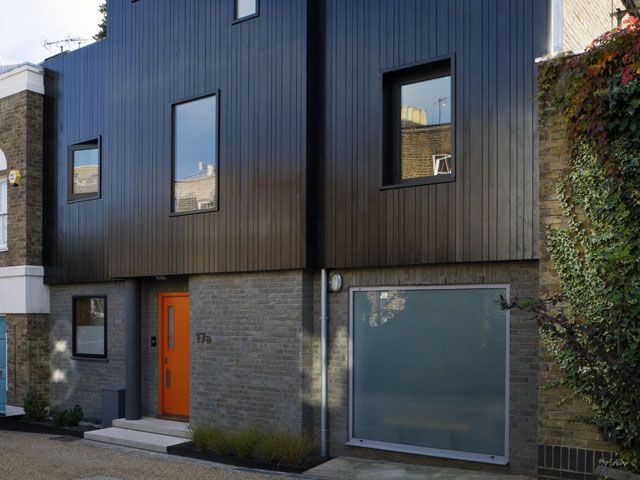 A modern facade on a period property by Studio 54 Architecture, photo by Sarah Blee