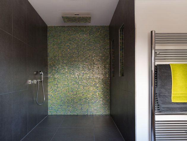 accessible en suite bathroom with iridescent mosaic tiles in green 