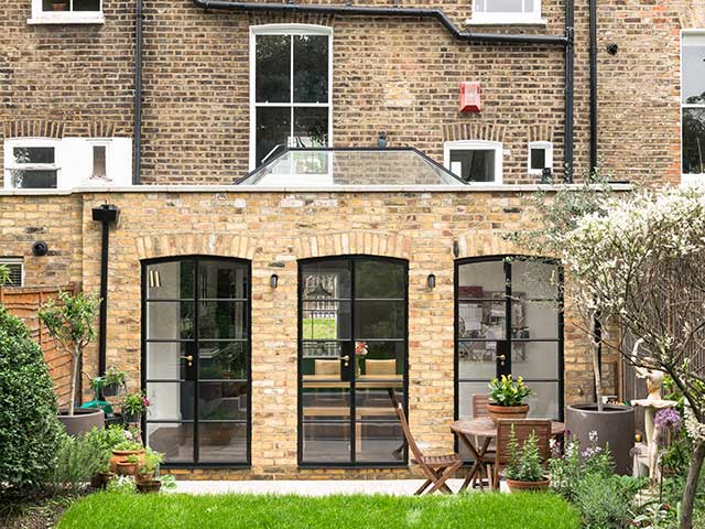 Reclaimed bricks on a stylish extension overlooking a garden