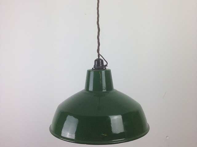Green hanging ceiling light on white background
