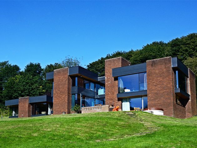 peter womersley house exterior red brick glazed hillside black finishes