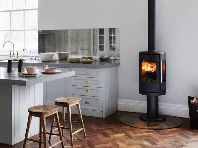 wood burning stove by morso in open-plan kitchen-diner