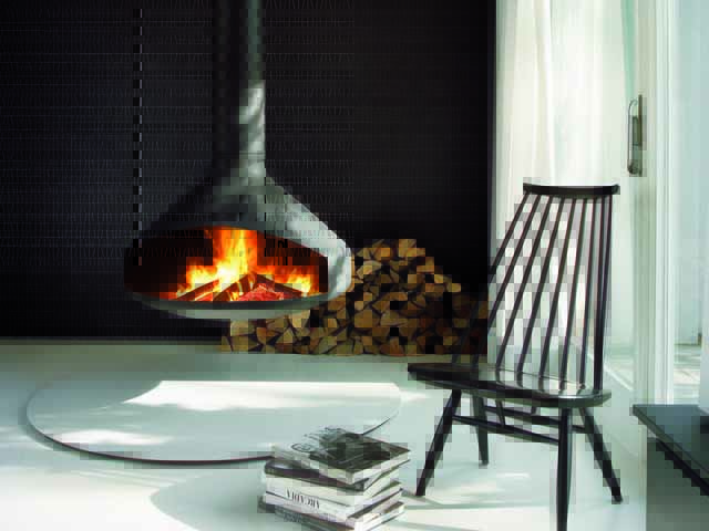 Floating wood burning stove in contemporary house by Focus fireplaces 