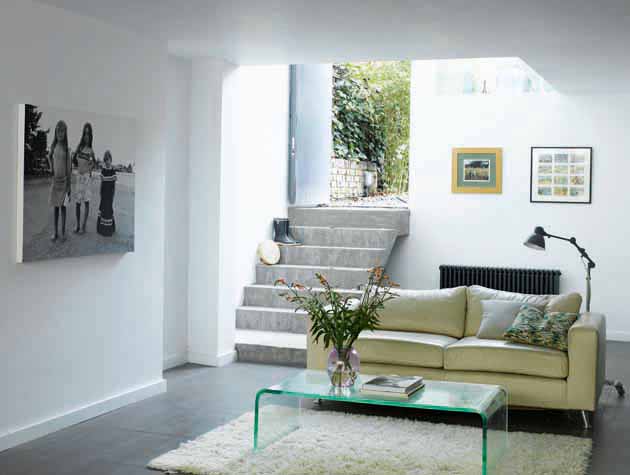 a renovated basement turned into a living room in an old house 