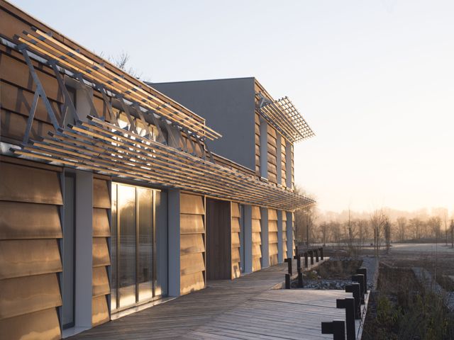 the lodge by FACIT - the exterior of a custom built home at sunset