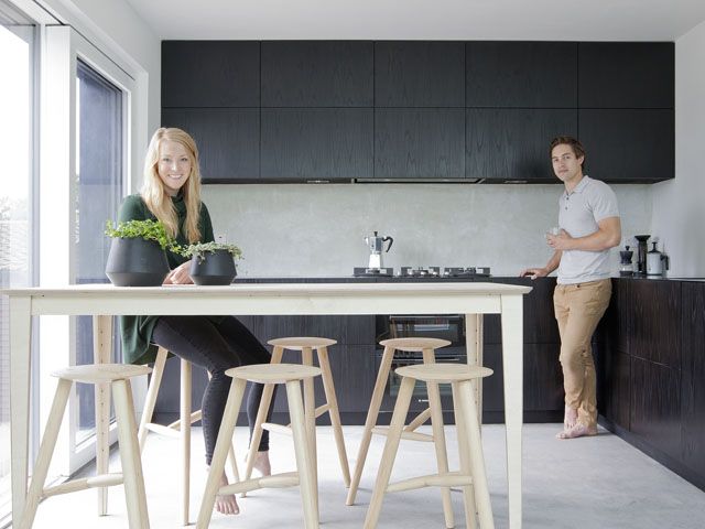 joe stuart and lina nilsson in their kitchen in their east london house, featured in Channel 4's grand designs tv series in 2017