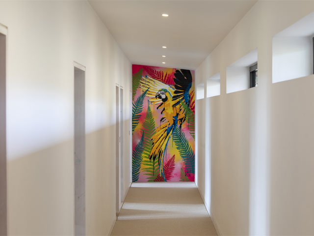 65ft-long white corridor with colourful artwork in Ferris Bueller-inspired Grand Designs house