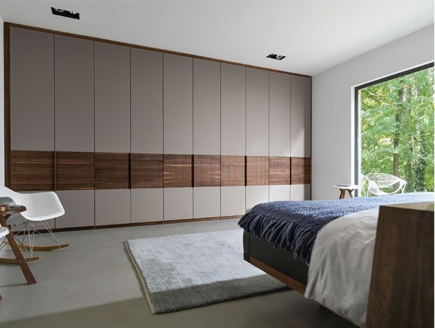 Bedroom with built-in wardrobe storage cupboards -team-7-home-improvements-granddesignsmagazine.com