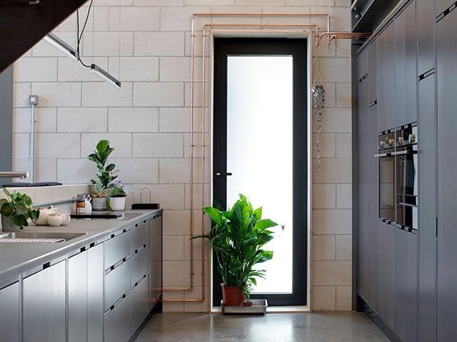 copper piping in the open plan kitchen in built by identical twins 