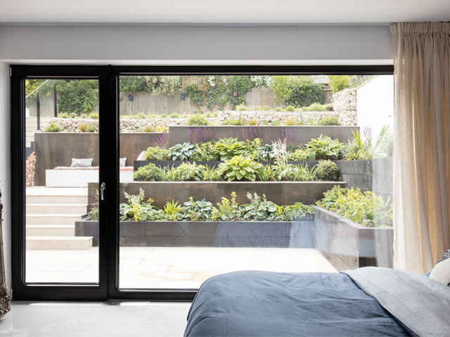 Born and Elinor's bedroom leads out to the sunken garden. Photo: David Giles