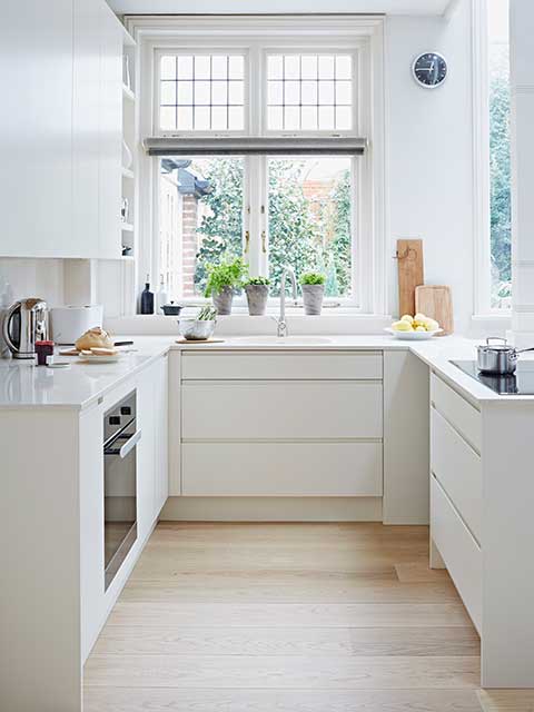U shaped kitchen layouts with shutter windows and white units with built in oven