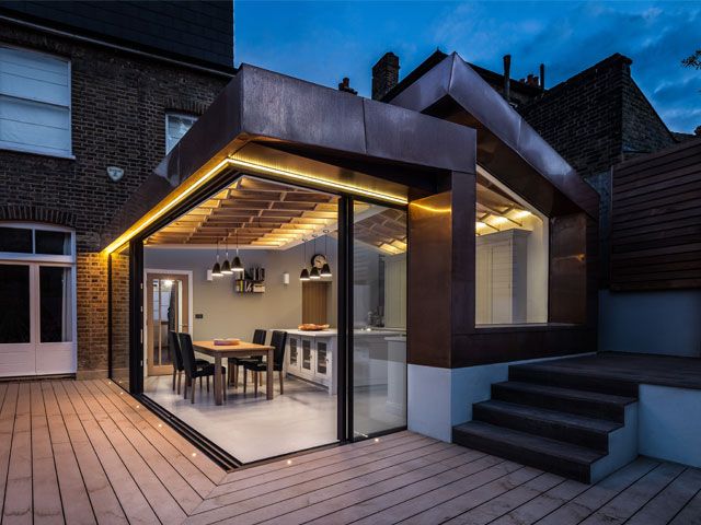 architectural lighting design in a kitchen extension with LED strips and floor spotlights by UV architects