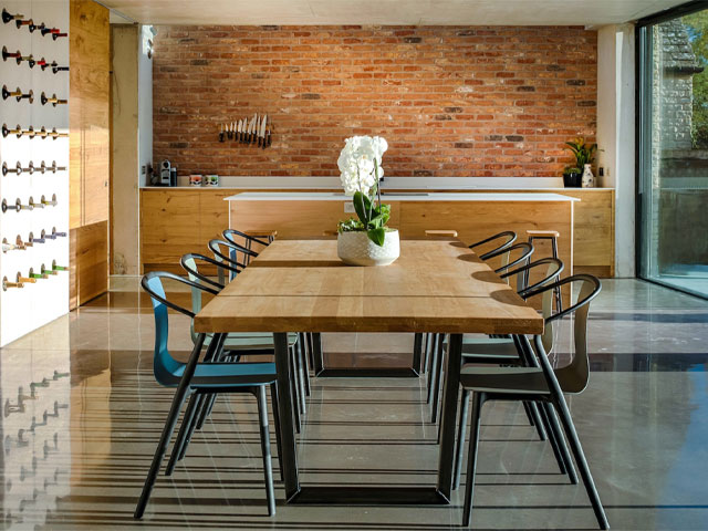 eight-seat dining table in a large open-plan space