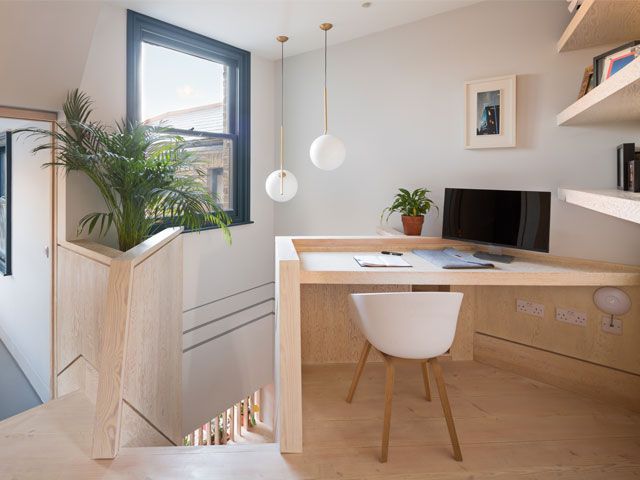 A home office, stair top work space wooden built in a Victorian terraced home with a desk -fraher-architects-home-improvements-granddesignsmagazine.com