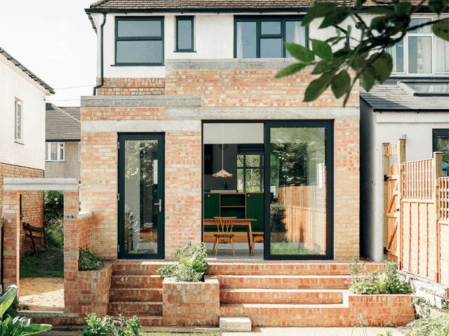 Exterior brick kitchen extension with brick steps grey brick tops