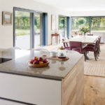 Inside Andrew Lloyd Webber's Baufritz home with open plan kitchen and large sliding windows