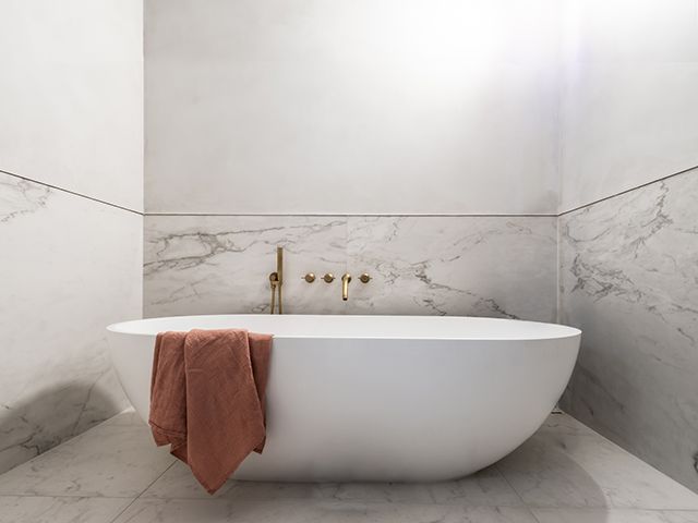 watermark collection ensuite bathroom freestanding bath in wet room - goodhomesmagazine.com