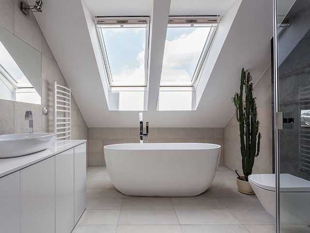 small size freestanding bath in modern attic setting - granddesigns 