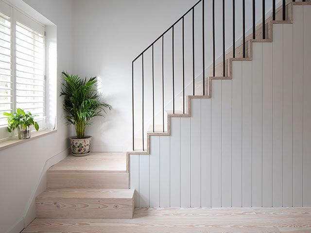 home with modern staircase and light flooring - grand designs 1920s house extension