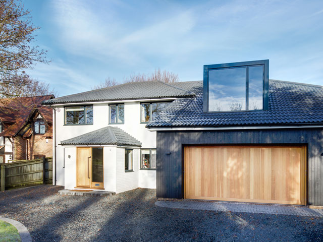 Add an extra bedroom above the garage like this one by OB Architecture