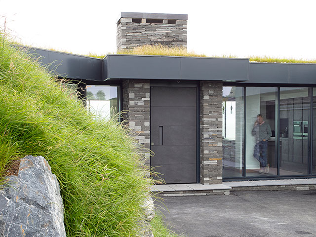 entarnce to modern self build home built into a clifftop featured on grand designs