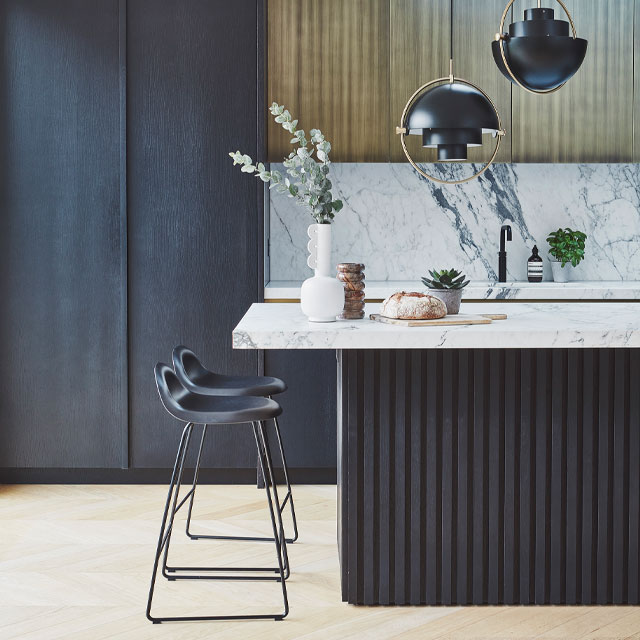 dark kitchen cabinets and island with slatted timber cladding