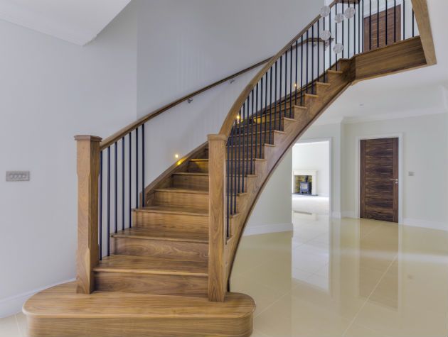 bespoke timber staircases like this curved sweeping staircase can transform a home