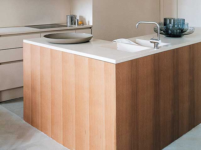 Eco friendly solid surface in stripped back kitchen space