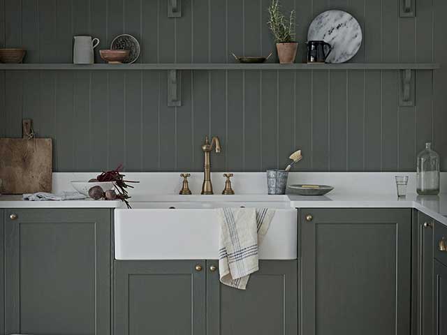 White kitchen worktop with panelled walls in contemporary kitchen