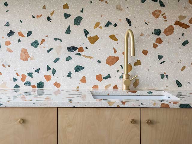 Terrazzo stone wall and worktop in kitchen