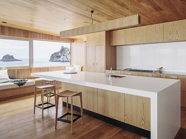 oak modern kitchen with view - Fisher Paykel case study Hahei House by studio2 architects - self build - grand designs New Zealand home
